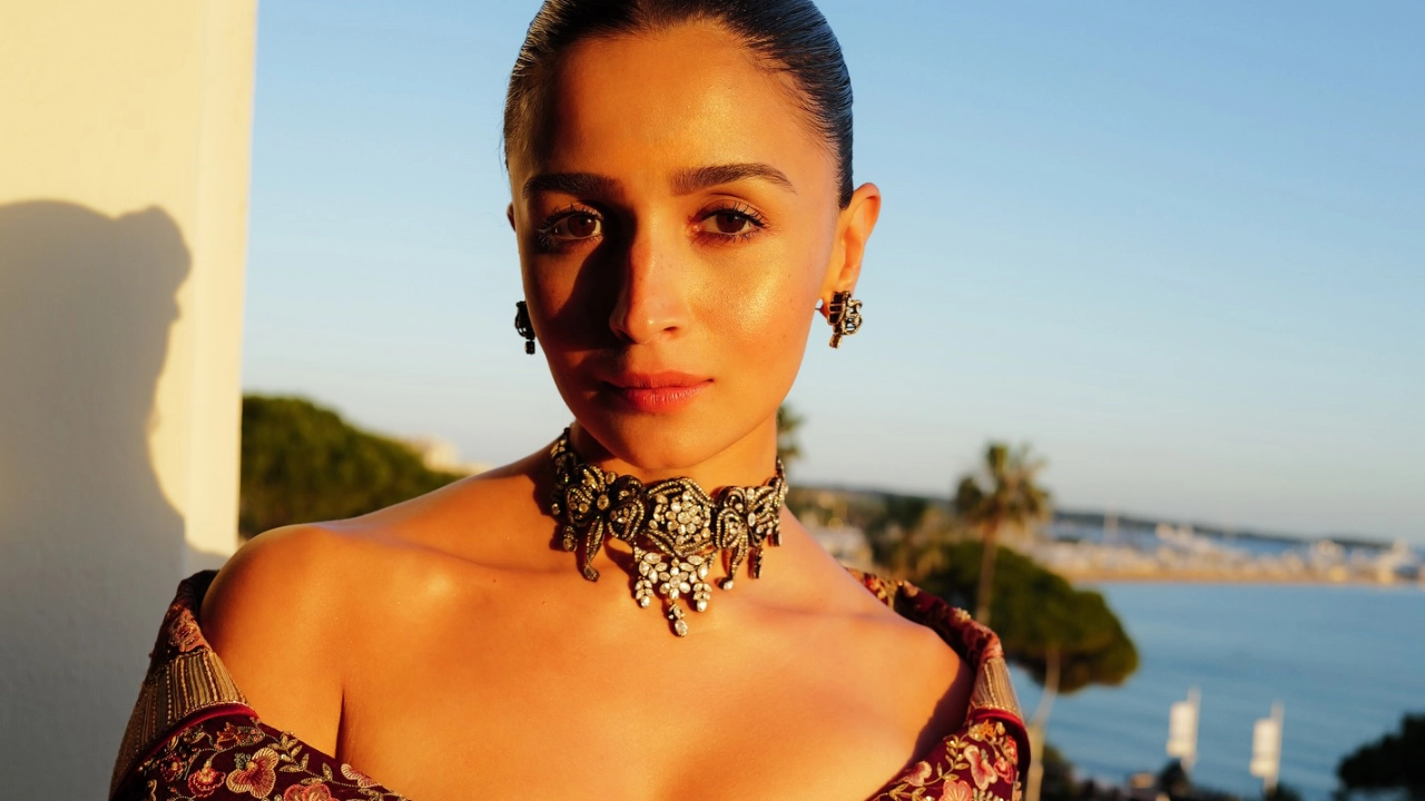 Alia Bhatt Stuns in Regal Off-Shoulder Maroon & Gold Ensemble at Cannes 2026 – Pure Royalty